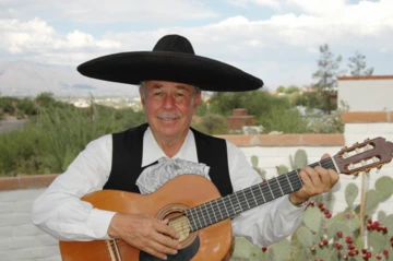 Dr. V with guitar and suit